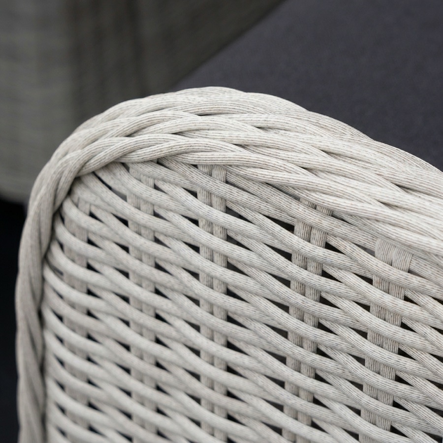 Close-up of the hand-woven white resin weave on the back of a Nova armchair